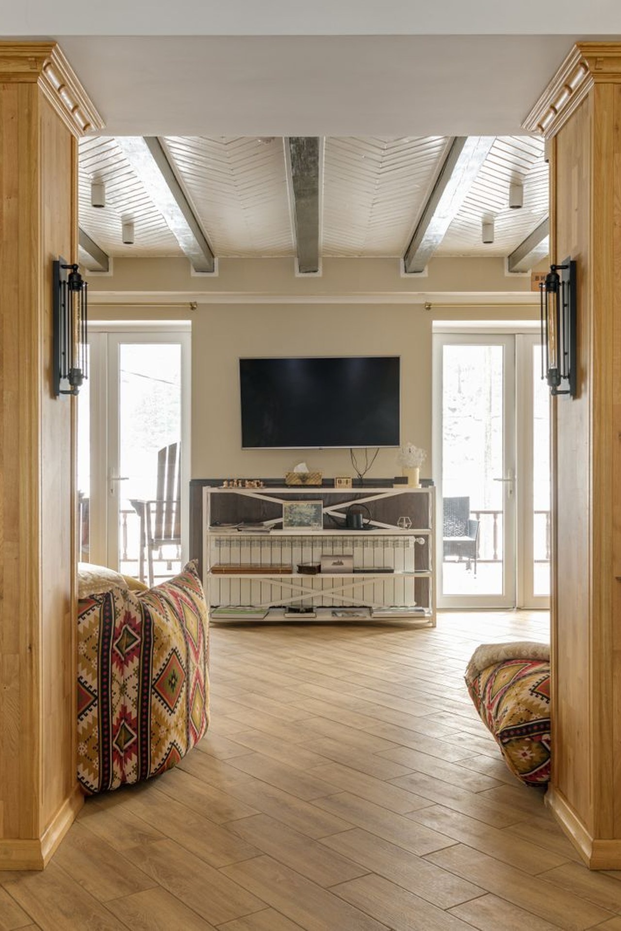 Refined residential interior with timber columns and natural wood flooring — illustrative image